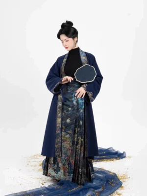 Full-length view of a navy embroidered Hanfu coat layered over a black inner top and colorful celestial-print Mamian skirt