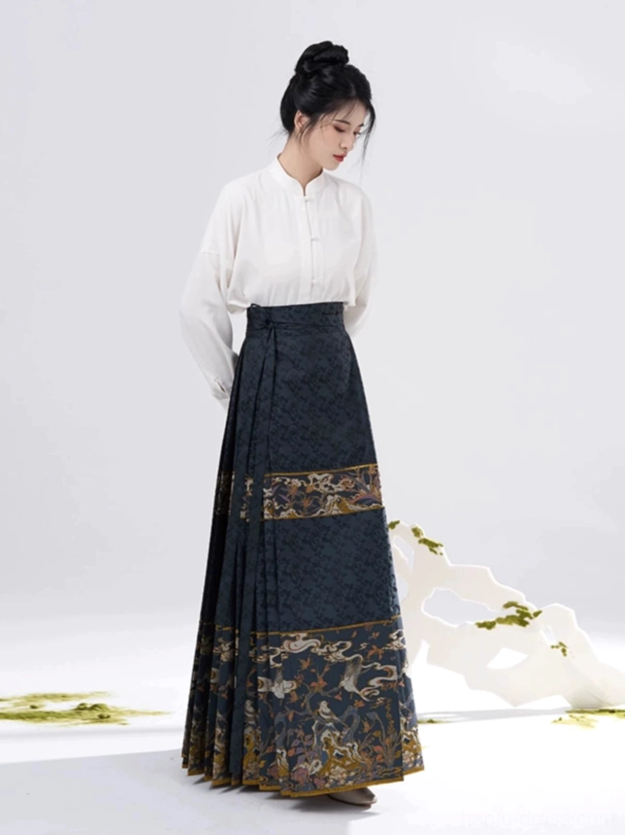 Side back view of navy gold mamianqun horse-face skirt styled with a white stand collar Hanfu inner shirt