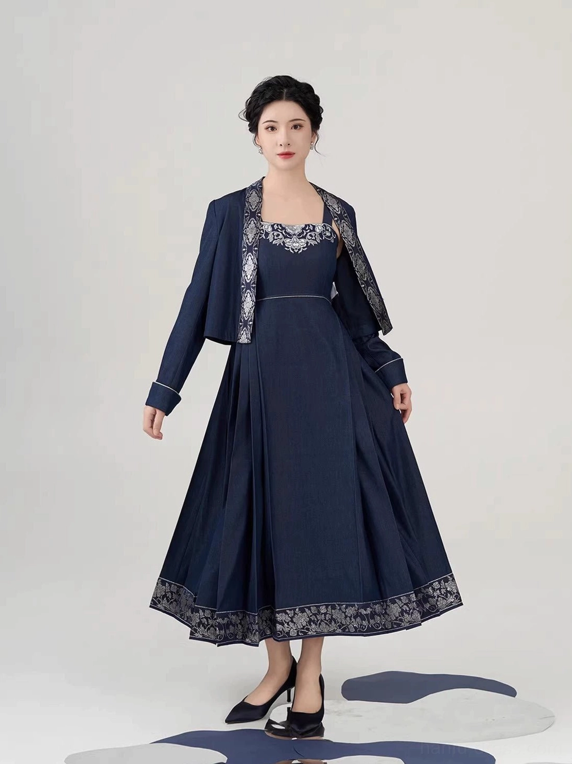 Front full body view of navy peony embroidered mamianqun inspired slip dress and cropped jacket set styled with black pointed toe heels