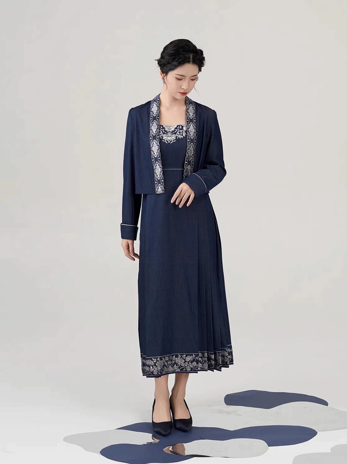 Side front full body view of navy silver peony embroidered mamianqun inspired dress with cropped outer jacket