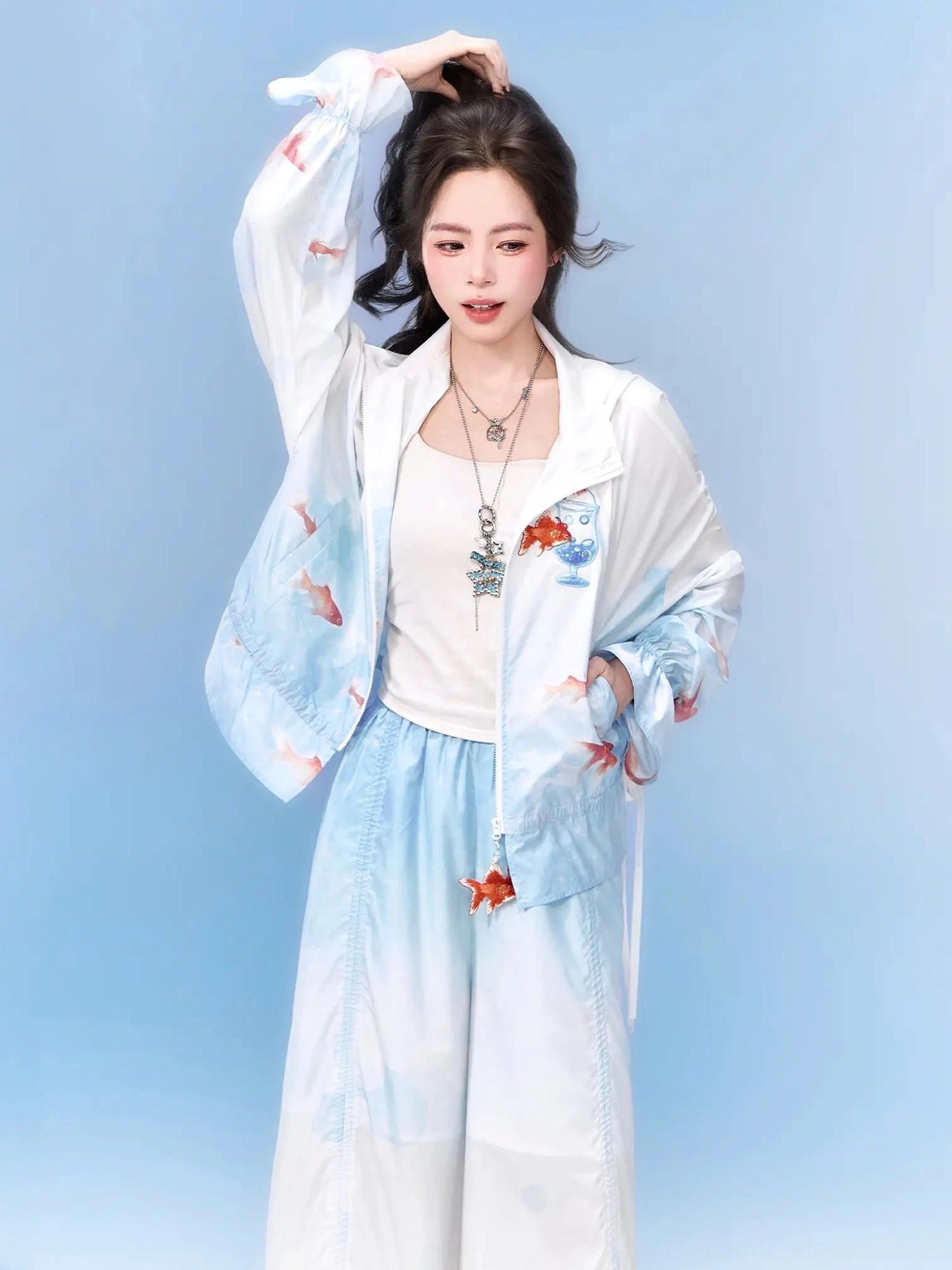 Front view of relaxed Neo-Chinese goldfish print hooded zip jacket and wide-leg pants set over a simple camisole