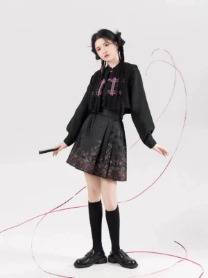 Full-length front view of a black Chinese-inspired blouse and mini mamian skirt outfit with pink plaid embroidery, colorful hem details, knee-high socks, and loafers