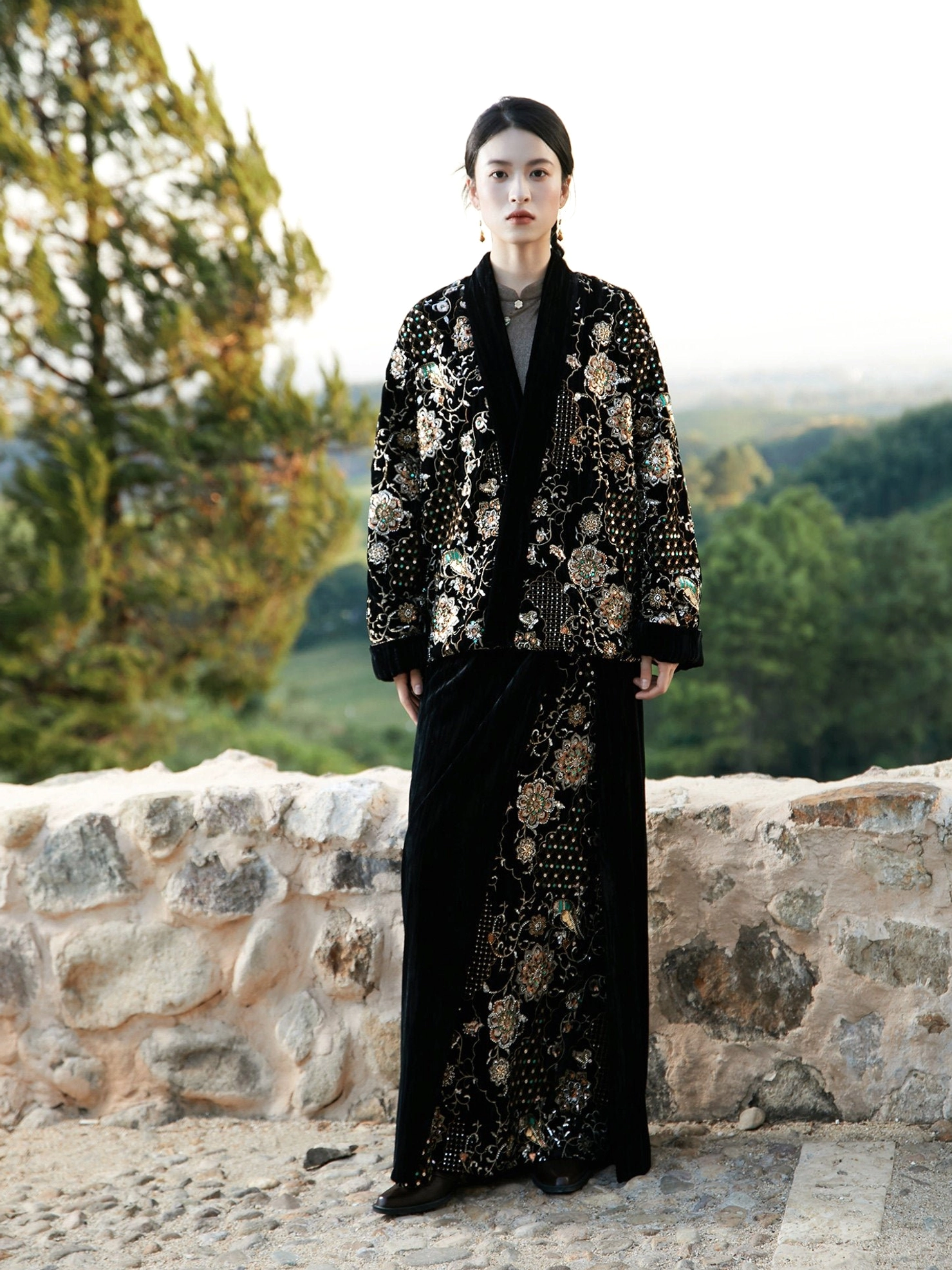 Full body outdoor portrait of black modern Hanfu wool-padded embroidered jacket and matching long velvet wrap skirt