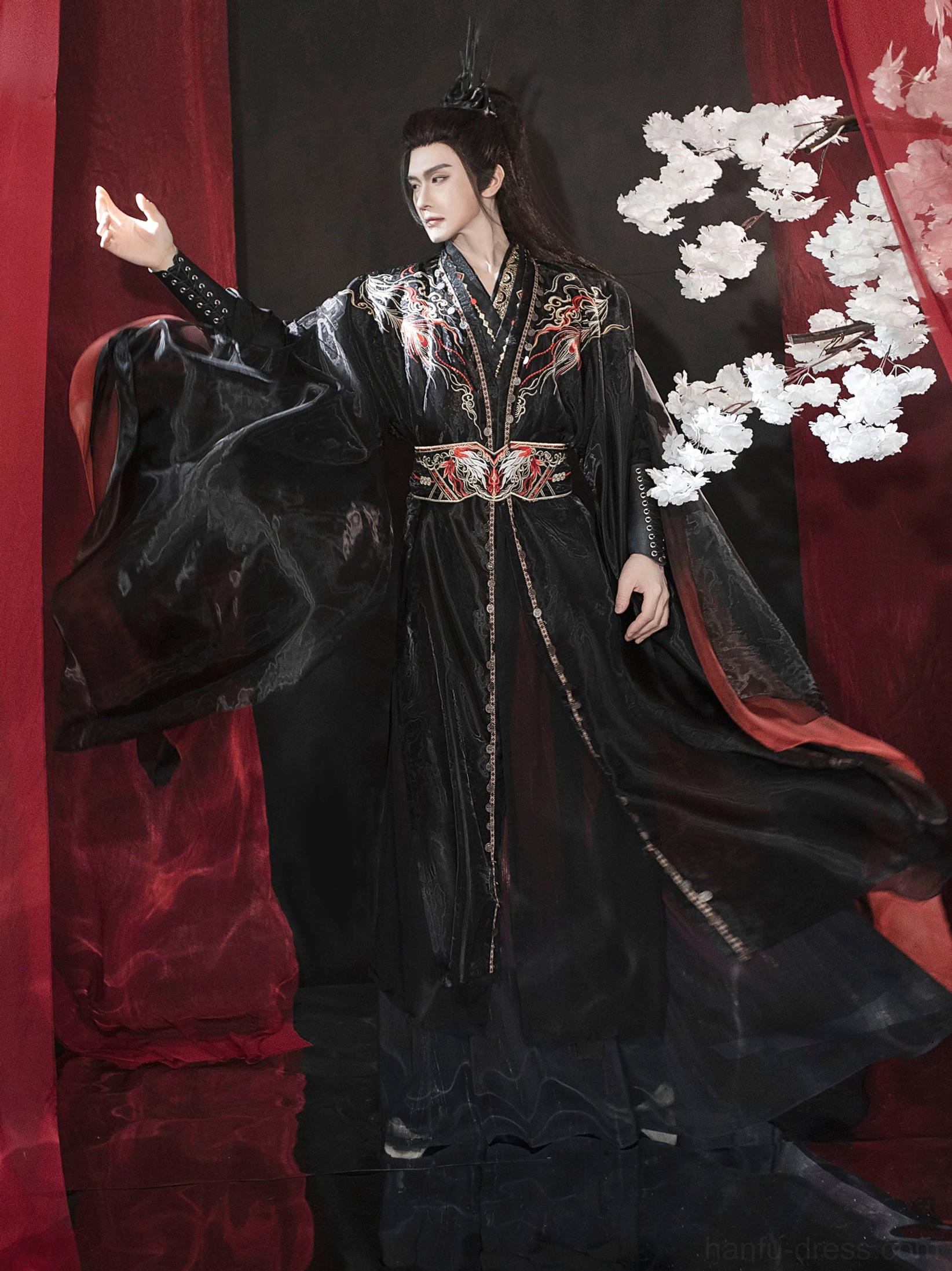 Three-quarter side view of men’s Xianxia hanfu outfit showing ornate waist belt, red underlayers, gold trim, and flowing outer robe