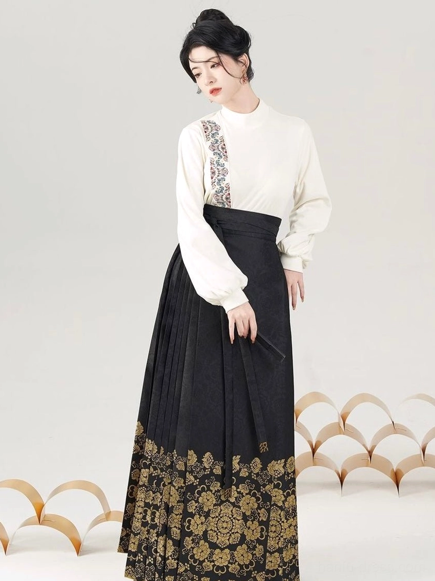 Front view of black modern Ming style Hanfu set with embroidered long sleeve top and gold floral mamianqun skirt