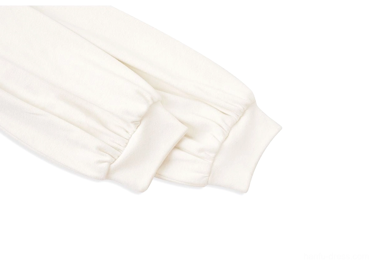 Close up of white modern Hanfu blouse sleeve with fitted elastic cuff and soft textured fabric