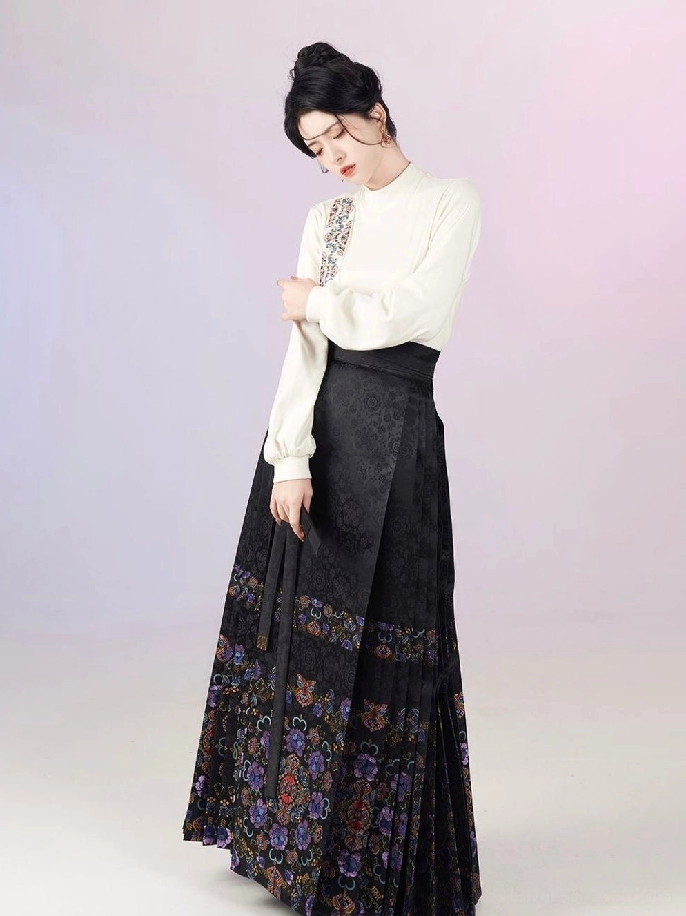 Minimalist modern Chinese Hanfu outfit with white long sleeve top and black pleated mamianqun skirt
