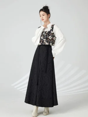 Side view of a modern Hanfu outfit featuring a white ruffled stand-collar blouse, dark floral bustier, high-waisted black maxi skirt, and light beige ankle boots