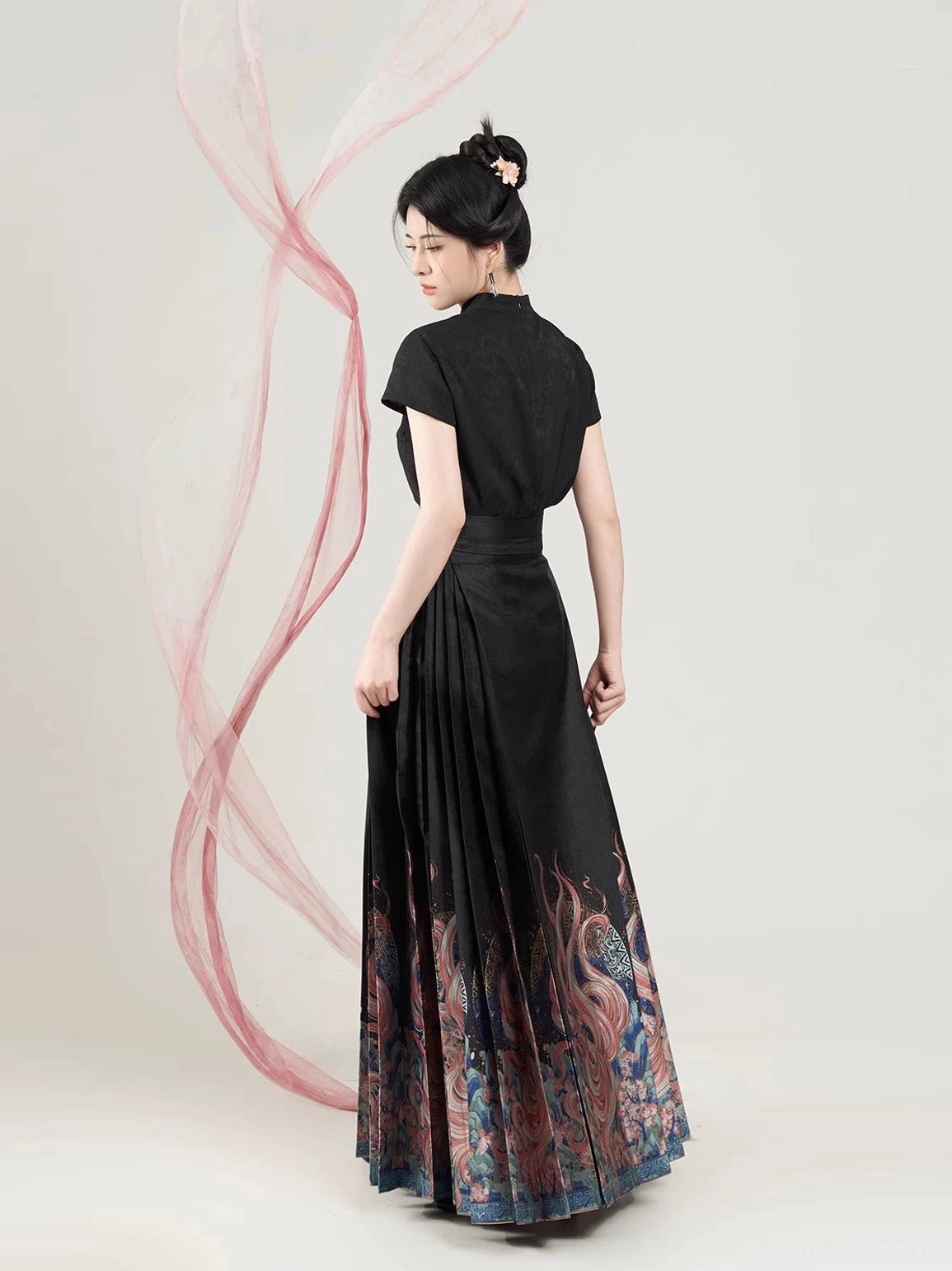 Back three-quarter view showing the fit of the black Nine-Tailed Fox Hanfu outfit and printed pleated skirt hem