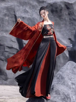 Full Nirvana Song Dynasty modern Hanfu set with red wide-sleeved Beizi jacket black camisole and black-red wrap skirt styled outdoors with a folding fan