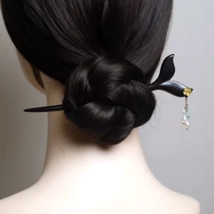 Northern Sea mermaid tail Chinese hair stick worn in a traditional Hanfu coiled bun with golden flower accent, pearl beads, and light blue tassel