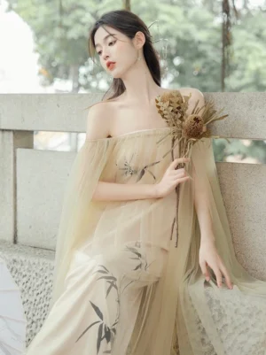 Side three quarter view of an off shoulder Tang Dynasty Hanfu dress with sheer chiffon overlay, flowing sleeves, bamboo print, and elegant layered silhouette
