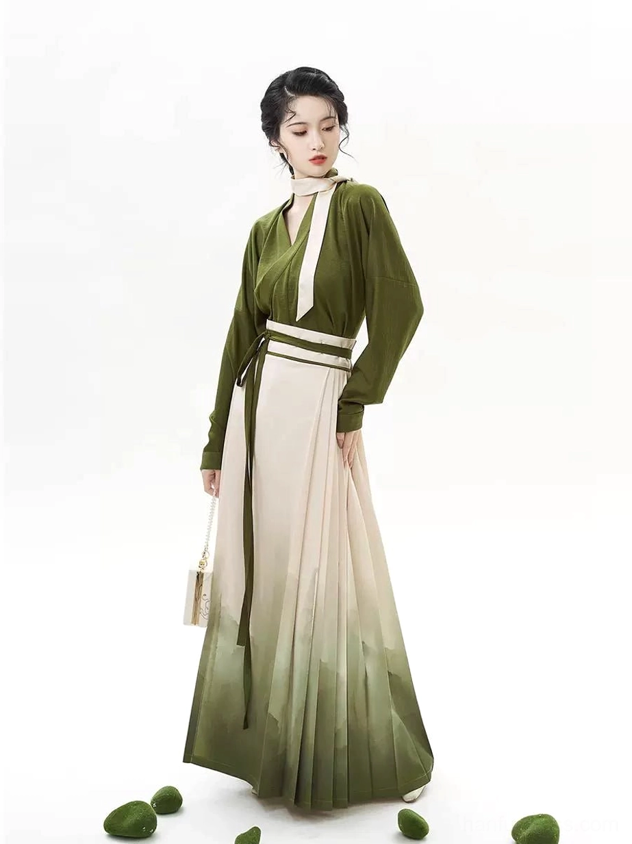 Front view of an olive green Ming Dynasty inspired Hanfu outfit with a pleated ink-wash landscape mamian skirt and matching waist sash