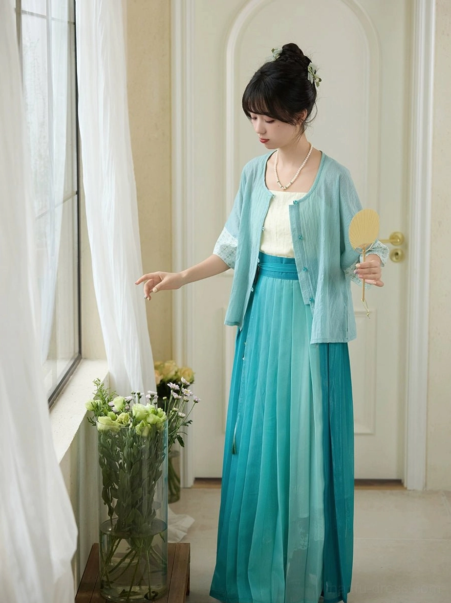 Side view of Only Green modern Hanfu with cyan cropped cardigan gradient teal pleated skirt and traditional Chinese round fan