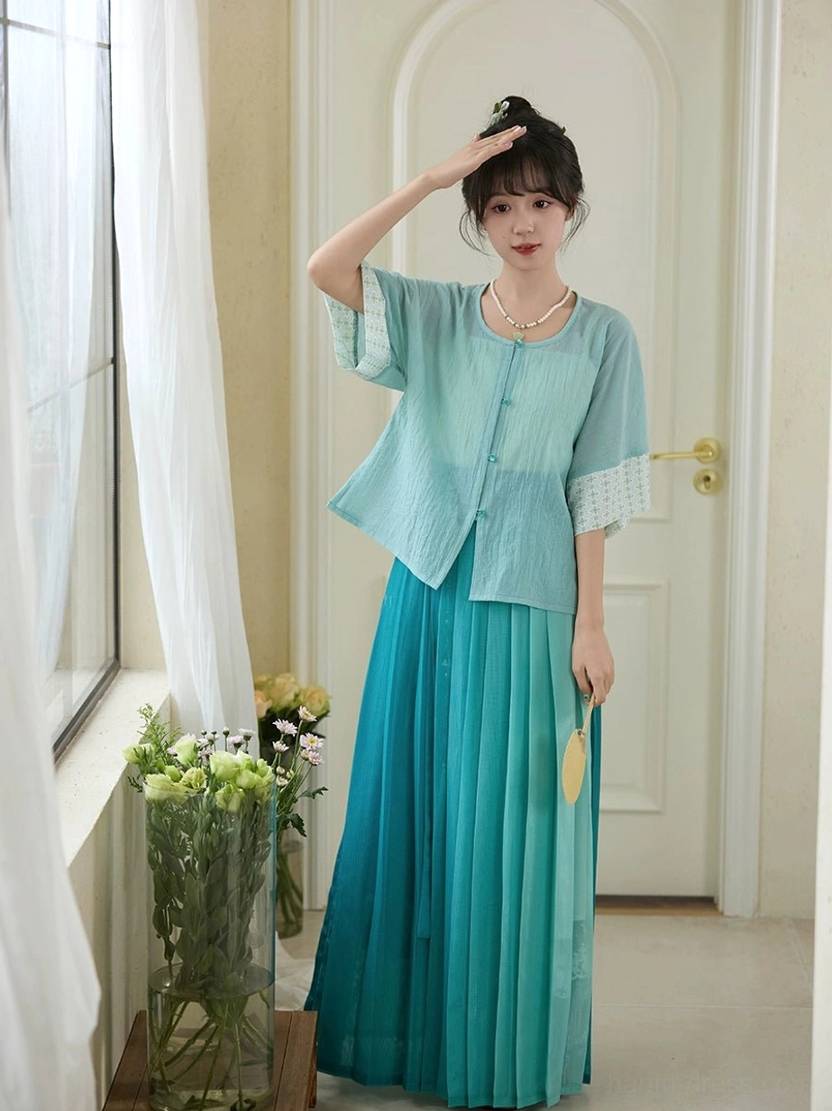 Full front view of Only Green modern Hanfu outfit featuring light cyan blouse ivory inner camisole and gradient teal pleated skirt