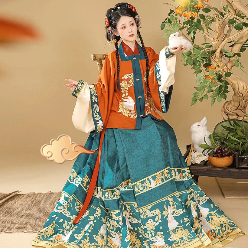Orange embroidered Ming Dynasty Hanfu jacket with teal green floral and Money Rabbit mamian skirt