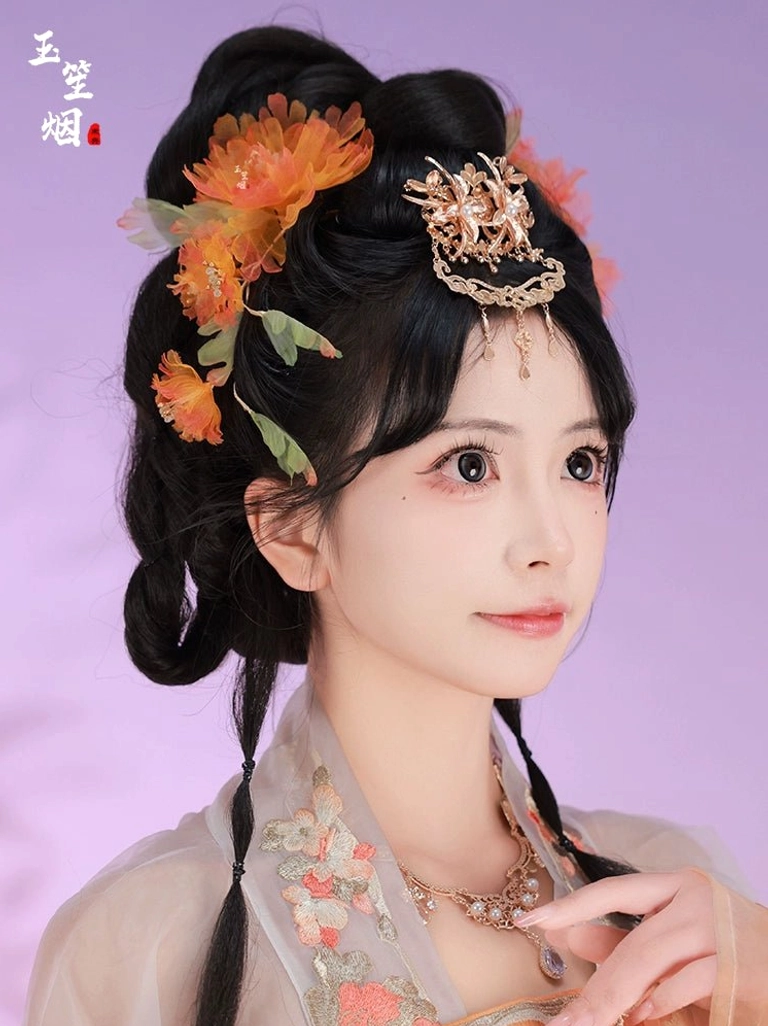 Side view of a woman wearing orange peony Hanfu hair ornaments with a carved golden forehead crown, hanging pendants, and elegant traditional Chinese updo