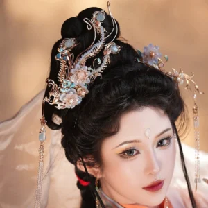 Close-up of ornate Chinese Hanfu hair accessories with enamel details, imitation pearls, flower ornaments, and long hanging tassels