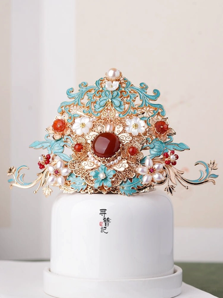 Side view of an ornate Chinese hanfu hair crown featuring symmetrical turquoise cloisonne-style floral patterns, central red gemstone accent, red beads, and white pearl-style flowers