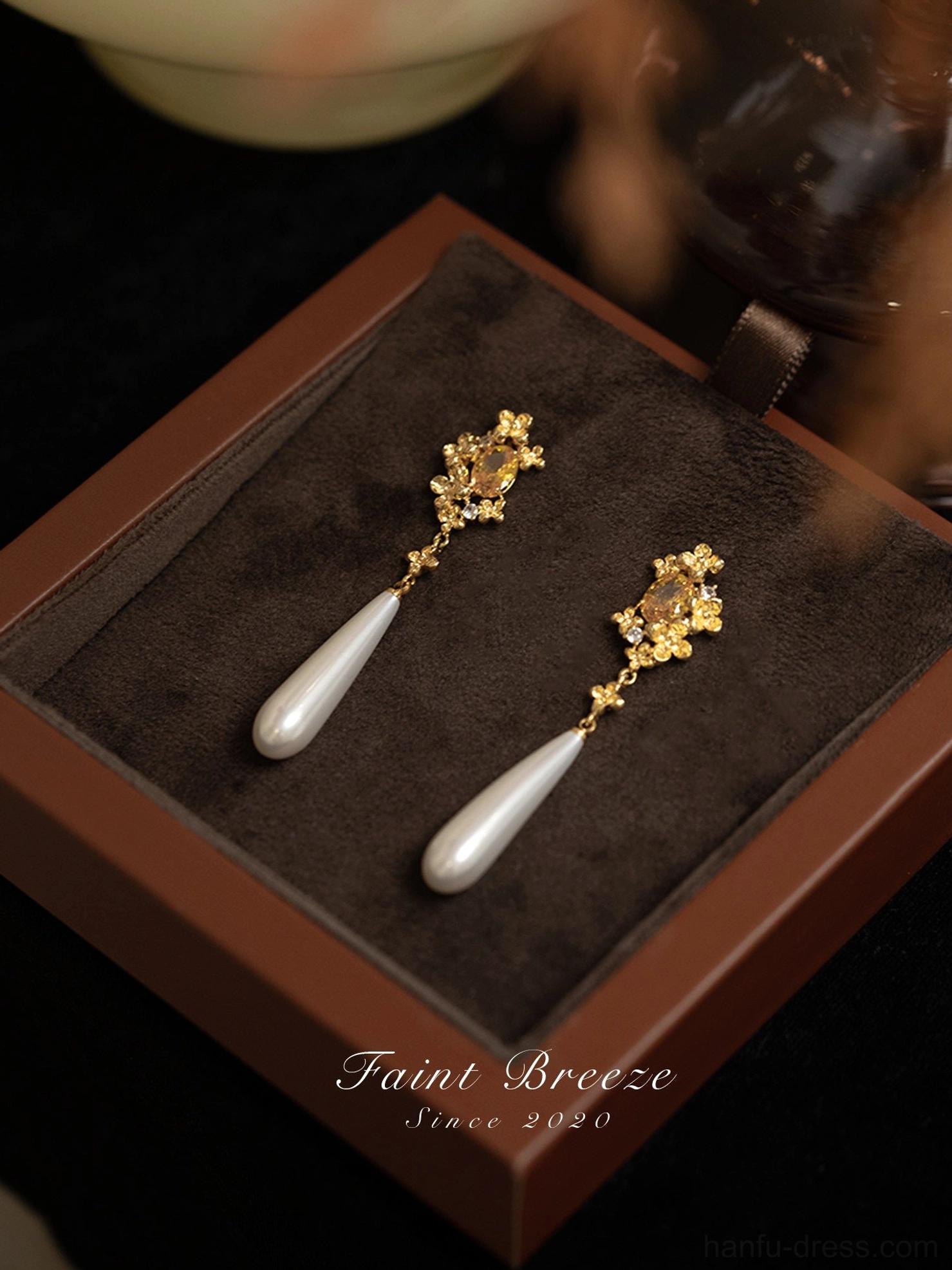 Pair of osmanthus flower pearl drop Chinese earrings presented inside a brown velvet-lined jewelry gift box
