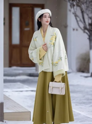 Osmanthus Song Dynasty Hanfu full set worn outdoors in winter with cream embroidered winged sleeve top and mustard yellow wrap skirt