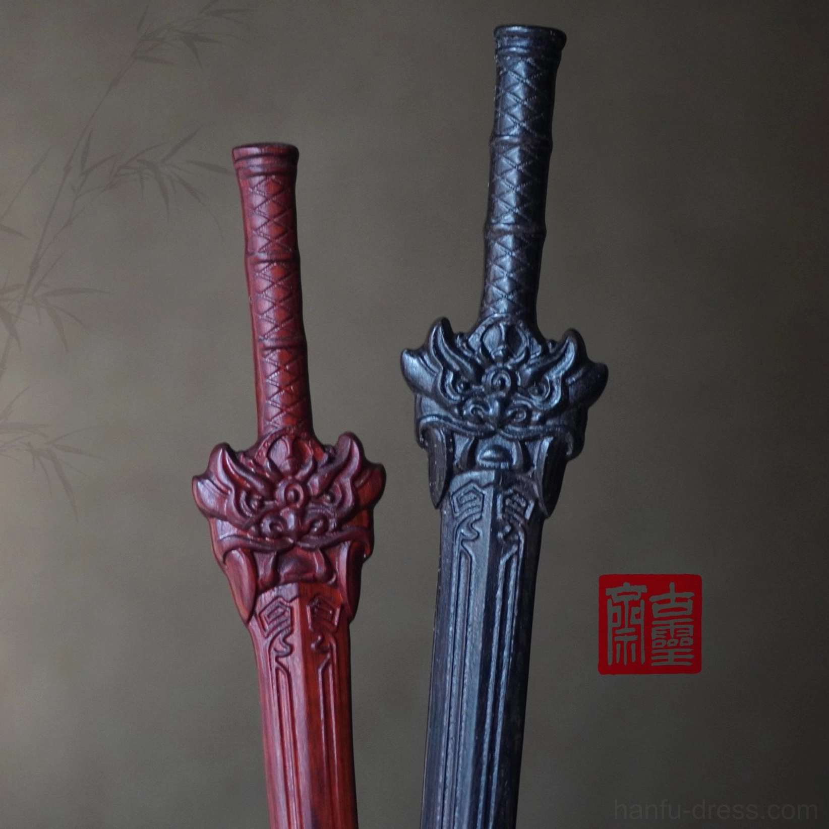 Pair of traditional Chinese sword-shaped hair sticks in wine red and black with matching carved beast ornaments for Hanfu and cosplay styling