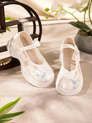 Pair of cream-white Chinese traditional Hanfu shoes with matching red-crowned crane embroidery, elevated white platform soles, Mary Jane straps, and breathable mesh insoles