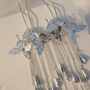 Pair of matching silver butterfly tassel hair pins displayed flat, with layered chain tassels and dangling pendants for Hanfu and qipao hair styling