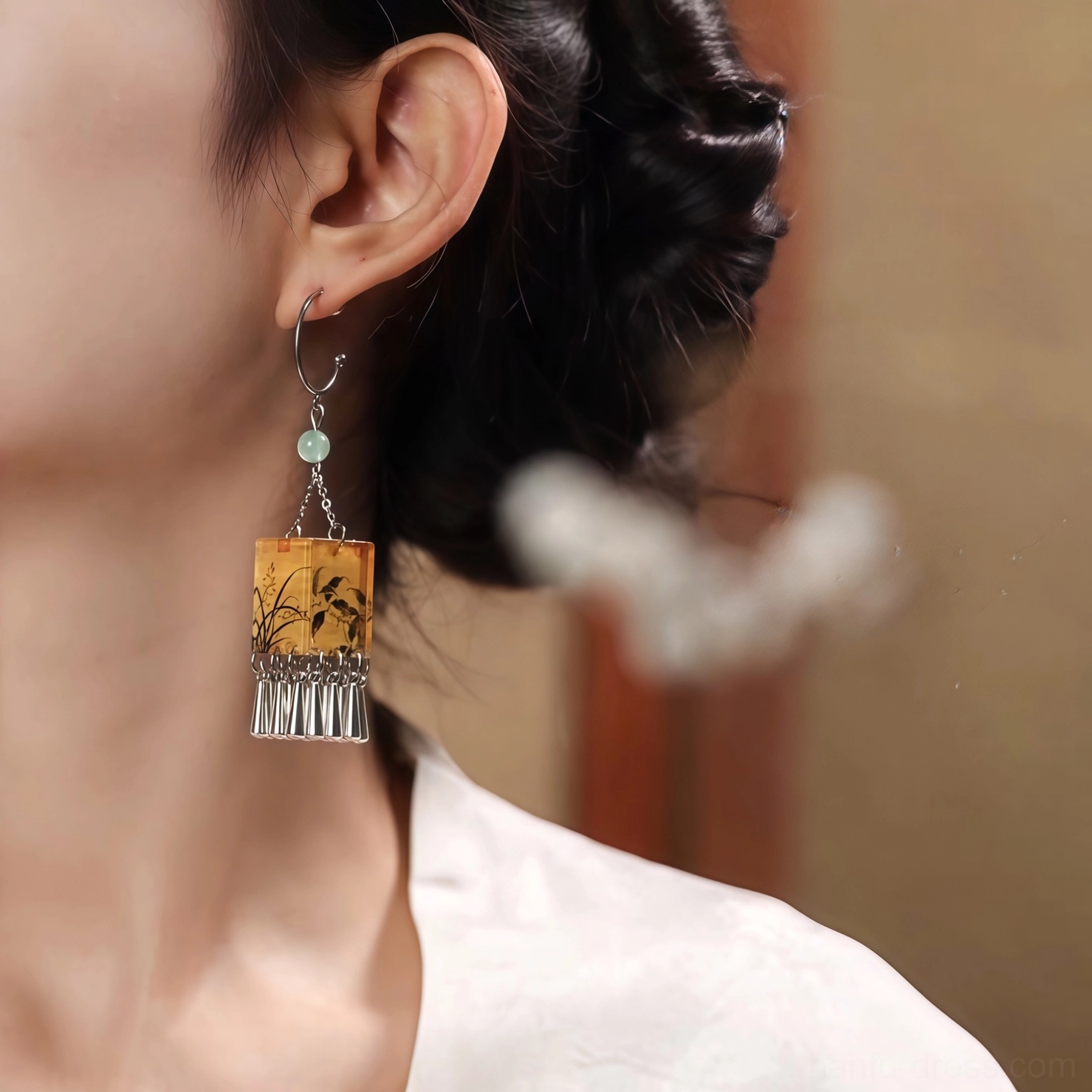 Rear side view of palace lantern orchid tassel Chinese earrings worn with white Hanfu collar