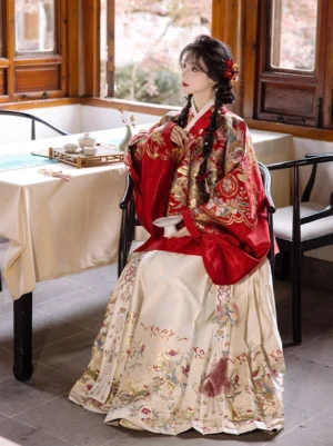 Parrot Joy Ming dynasty hanfu Chinese New Year dress with red embroidered pipa sleeve top and ivory mamian skirt