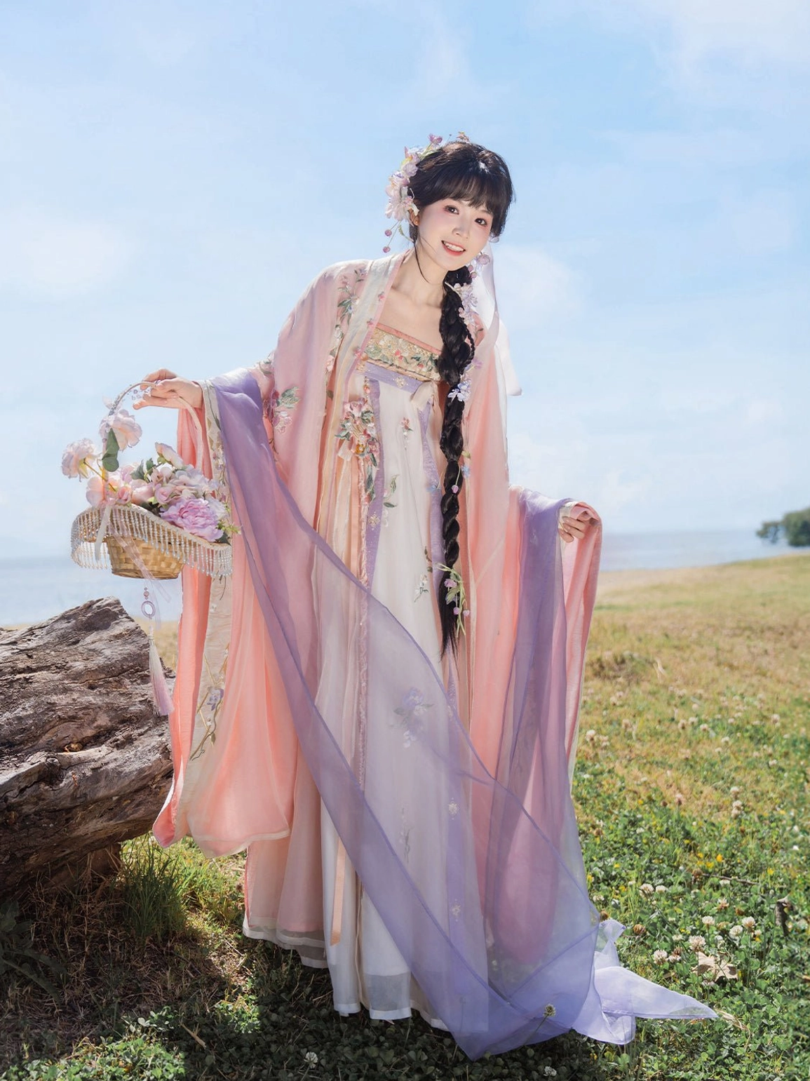 Pastel floral Tang Dynasty hanfu Qixiong Ruqun with purple sheer scarf and wide sleeves beside a lakeside lawn