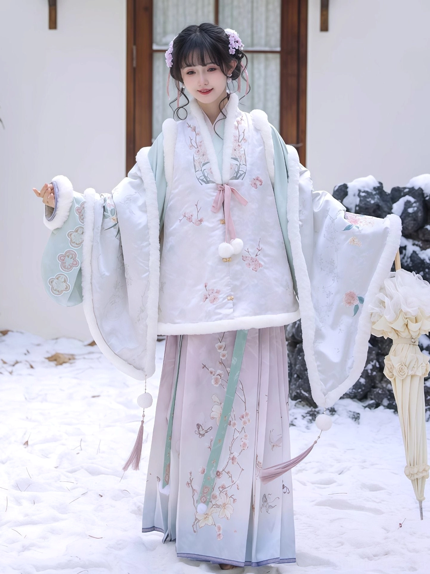 Side view of pastel Ming Dynasty Hanfu pipa sleeve top and flowing plum blossom mamian skirt with tassel ornaments