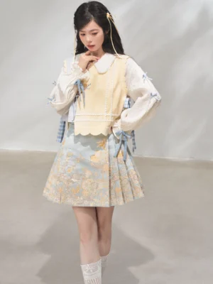 Female model wearing pastel modern Hanfu bijia vest blouse and light blue horse face skirt in studio
