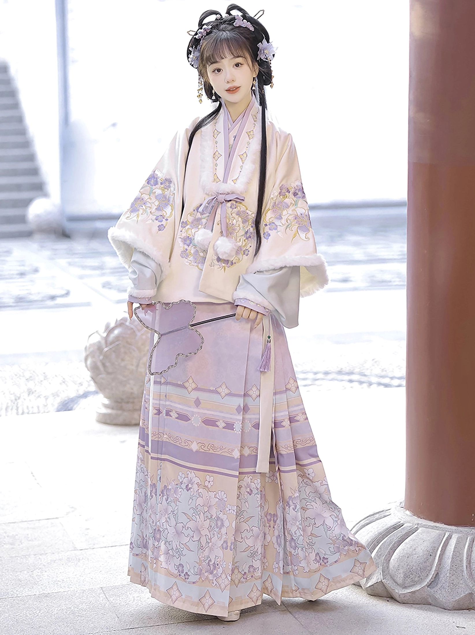 Pastel purple Ming Dynasty Hanfu set with cream floral embroidered jacket and printed Mamian skirt in a stone courtyard