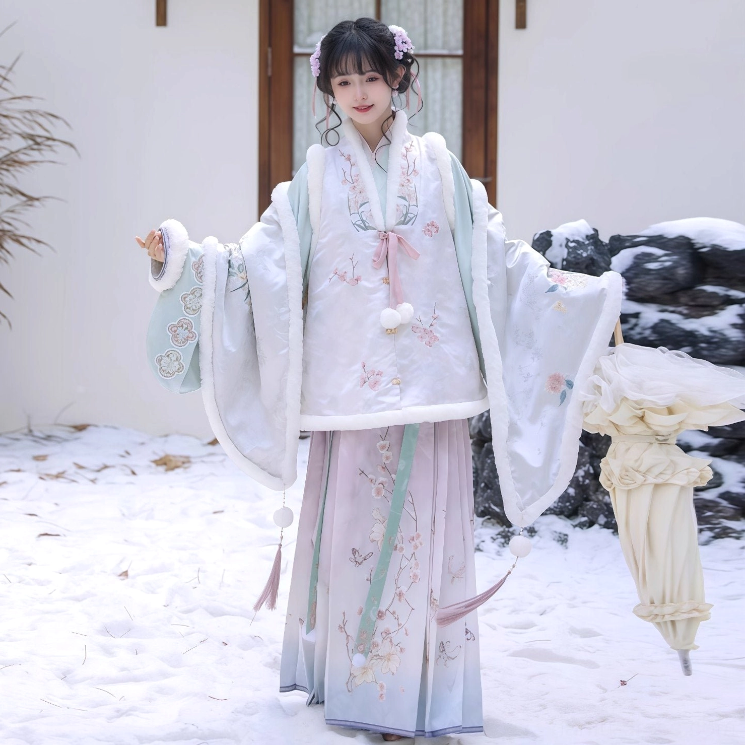Pastel winter Ming Dynasty Hanfu mamian skirt styled with embroidered bijia vest and oversized pipa sleeves