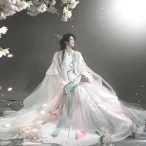 Full body side view of a unisex Peach Blossom Veil pink and white cross-collar Hanfu set with flowing floor length skirt sheer outer robe and traditional folding fan