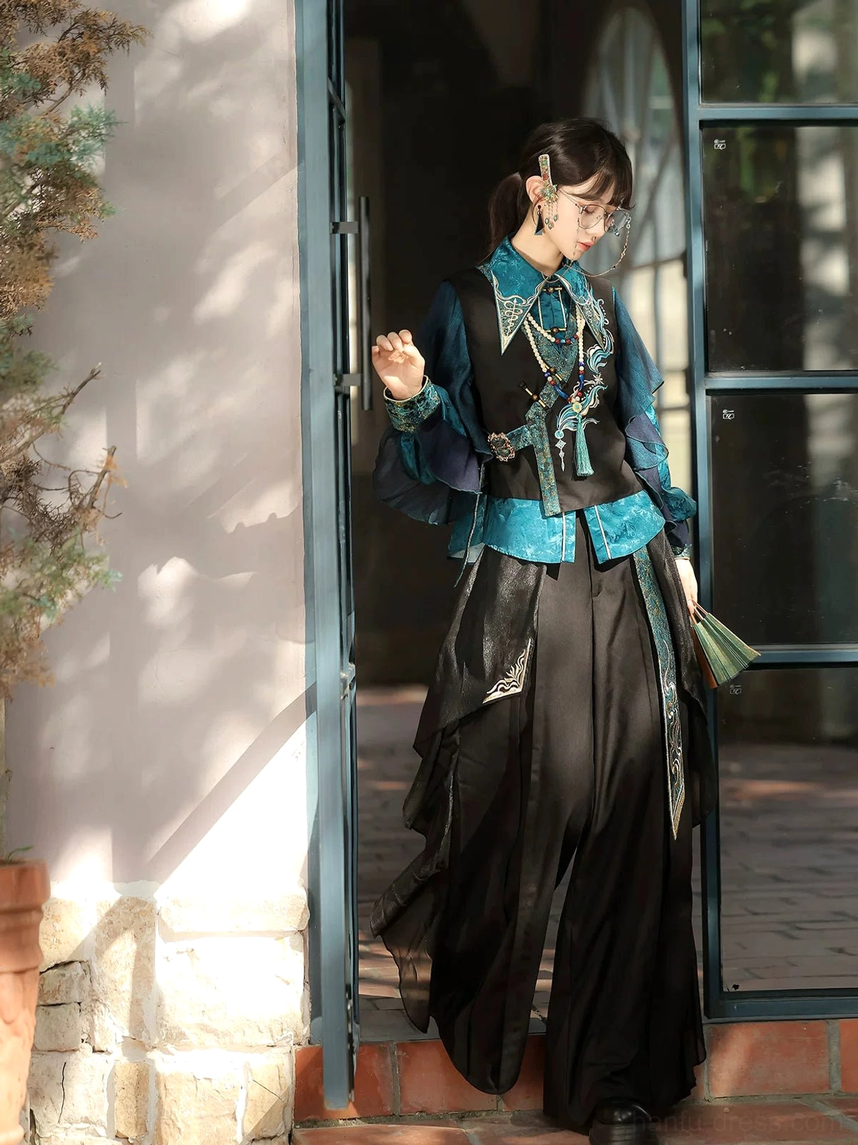 Complete peacock blue phoenix embroidered Modern Hanfu three-piece outfit at a villa doorway