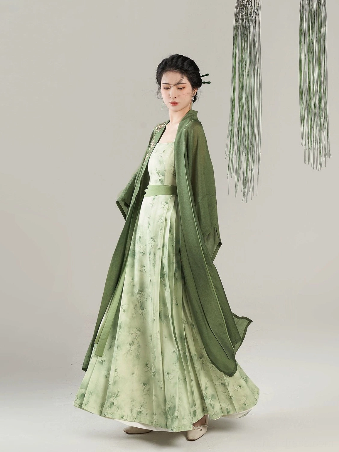 Song Dynasty Hanfu Pear Blossom Begonia set side view showing flowing sheer green overcoat and pleated floral maxi dress