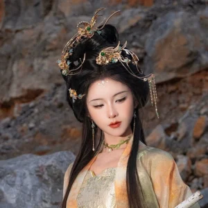 Three-quarter view of traditional Chinese Hanfu hair accessories with gilded floral ornaments, green accents, and dangling tassel details