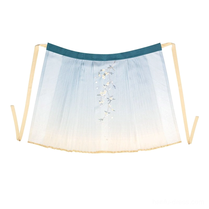 Blue to cream gradient embroidered Ming Dynasty Hanfu mamianqun skirt with green waistband gold hem trim and tie sashes flat lay