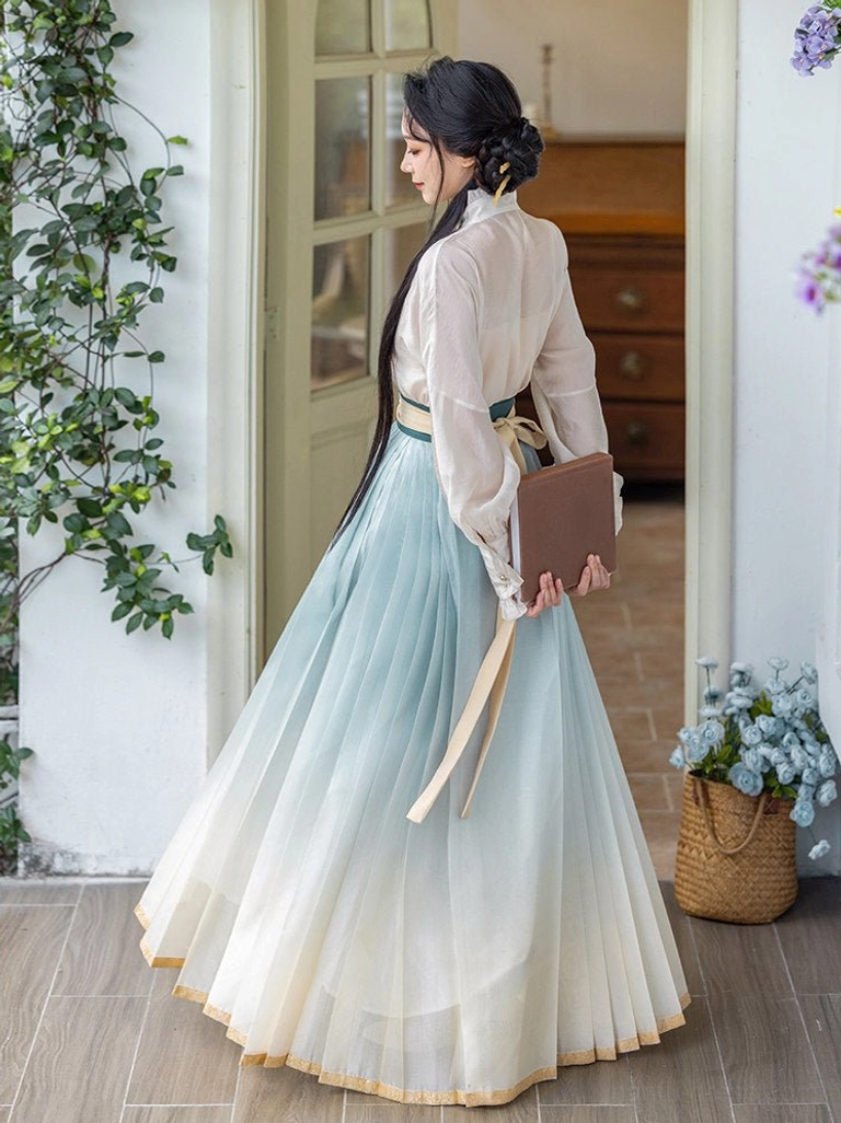 Pear Blossom Song Hanfu side back view with ivory standing collar long sleeve blouse and flowing blue cream mamianqun skirt