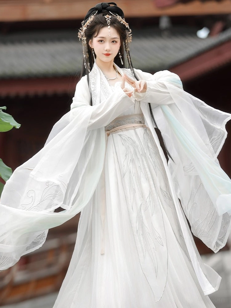 Three-quarter view of white Song Dynasty style qiyao ruqun Hanfu with delicate embroidery, blue gradient sleeve hem and waist sash
