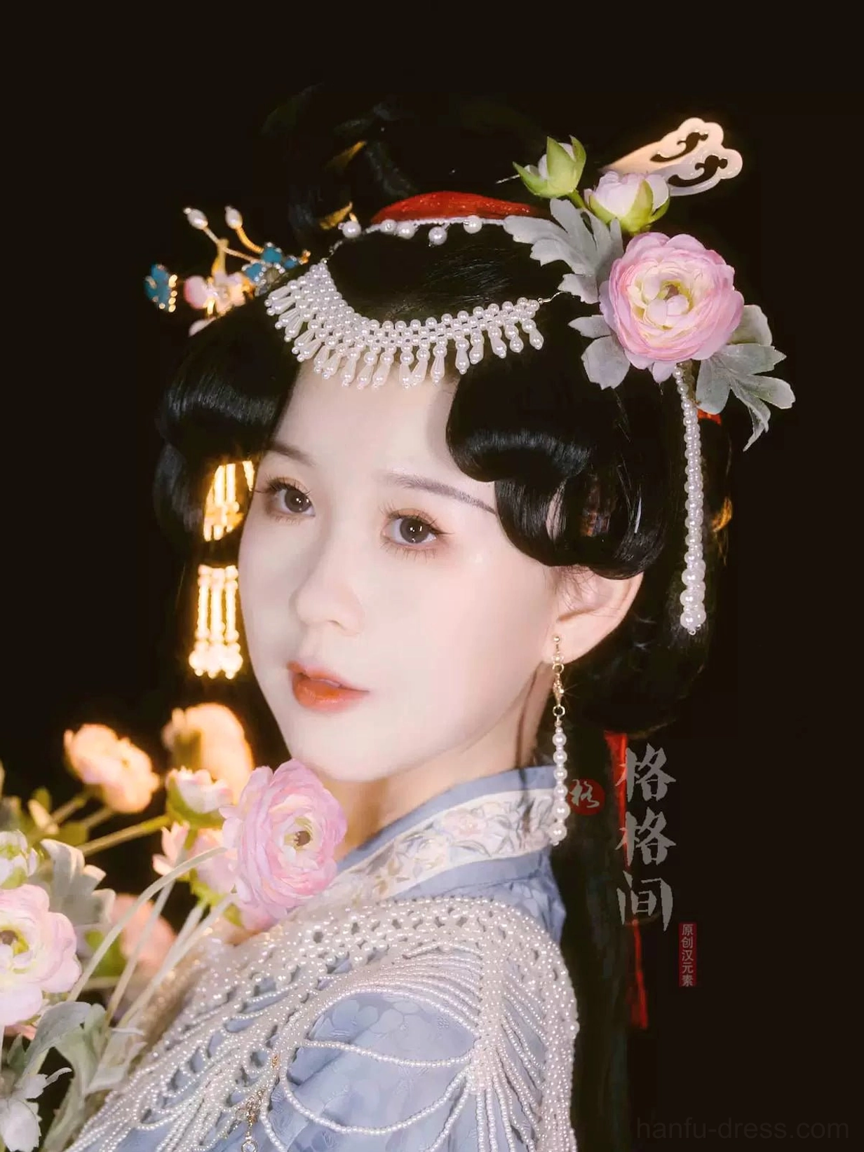 Side view of elegant Hanfu updo with pearl tassel hair pin, gold chain pendants, and matching long pearl earrings