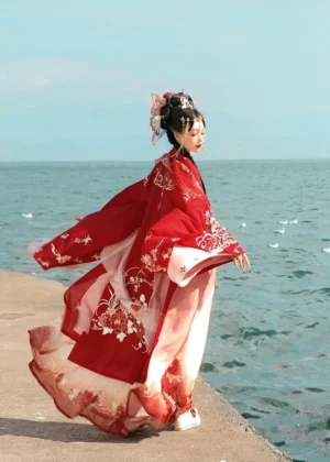 Side back view of Peony Flower God Tang Dynasty Hanfu Heziqun showing flowing wide sleeve coat and gradient pink red skirt