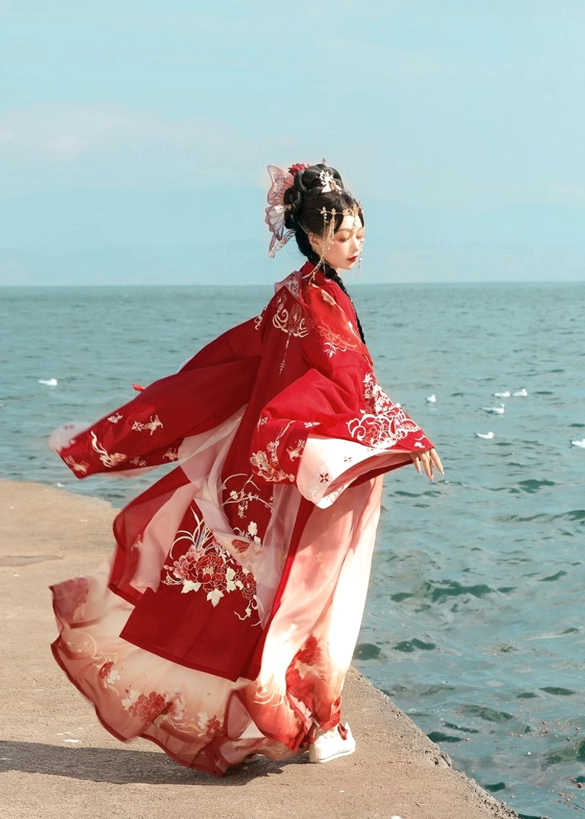 Side back view of Peony Flower God Tang Dynasty Hanfu Heziqun showing flowing wide sleeve coat and gradient pink red skirt