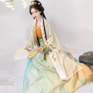 Song Dynasty inspired qiyao ruqun hanfu side view showing flowing beige beizi gradient skirt and round silk fan