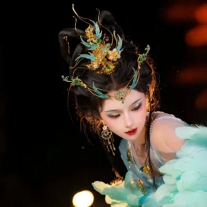 Three-quarter view of Chinese hanfu hair accessory set with phoenix filigree crown, forehead ornament, turquoise details, and drop earrings