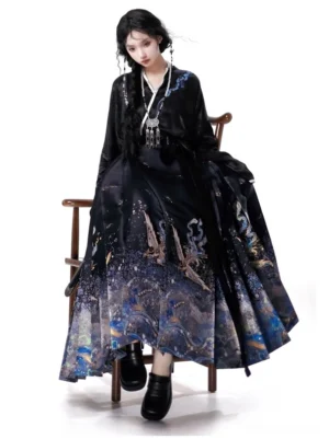 Full front view of a modern Ming style mamian skirt hanfu set with black cross collar top, starry blue silver landscape print, and golden green phoenix embroidery