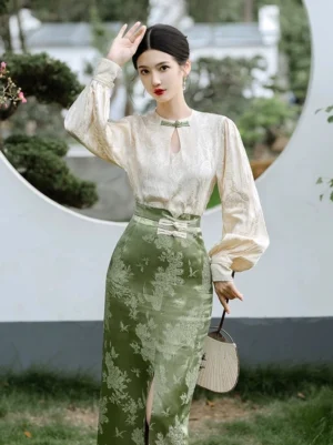 Front view of pine jacquard modern Hanfu cheongsam set with cream keyhole top and green floral wrap skirt