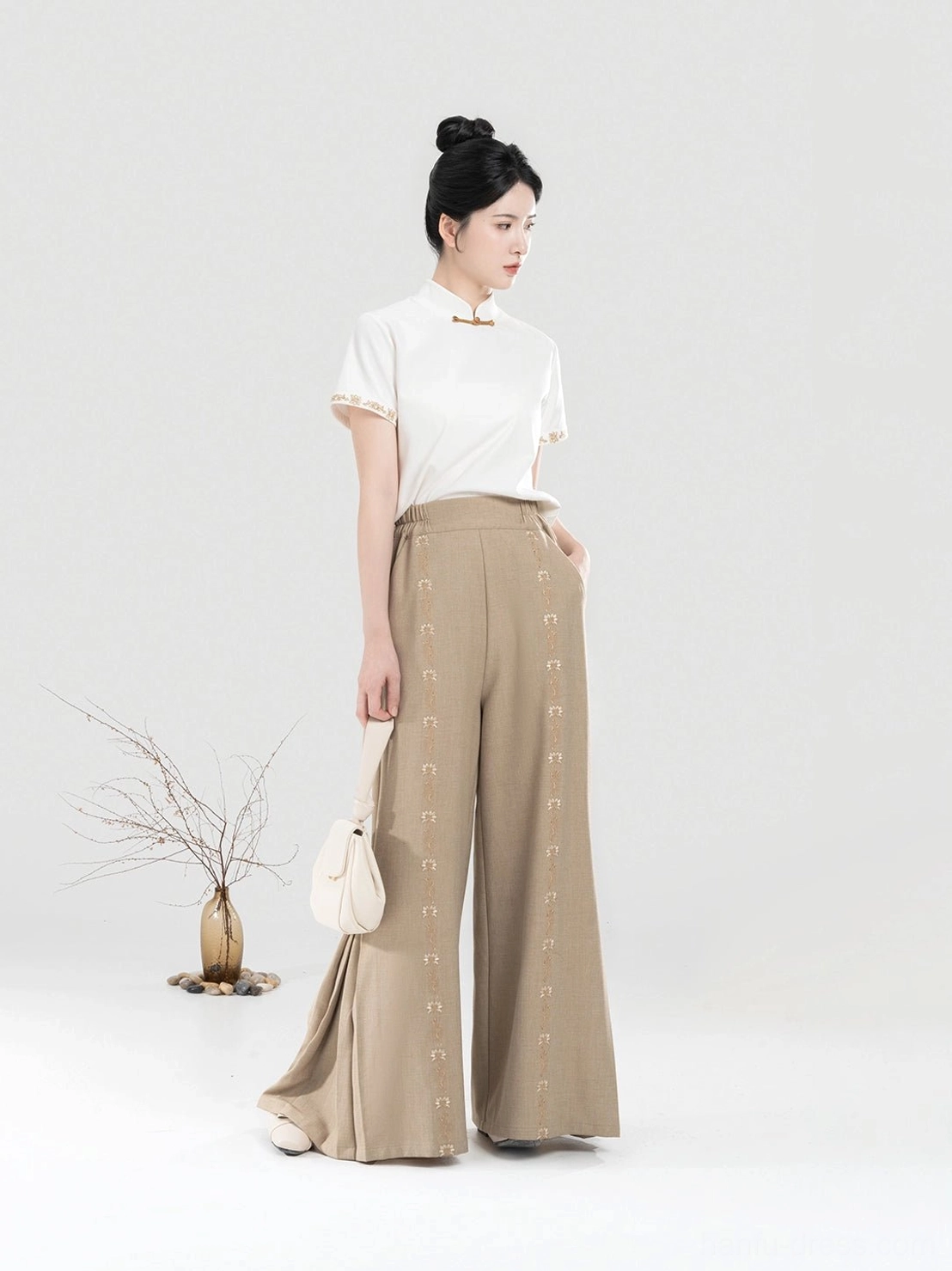 Women's Pinewood modern Hanfu outfit with ivory Chinese style top and flowing khaki wide-leg pants right side view